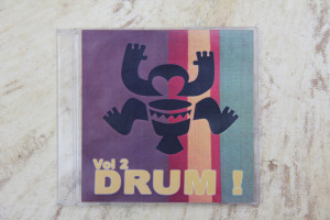 cover of CD with Melbourne Djembe logo playing djembe