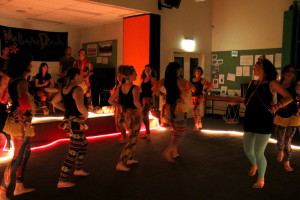 Dancers in bright leggings walking onto stage